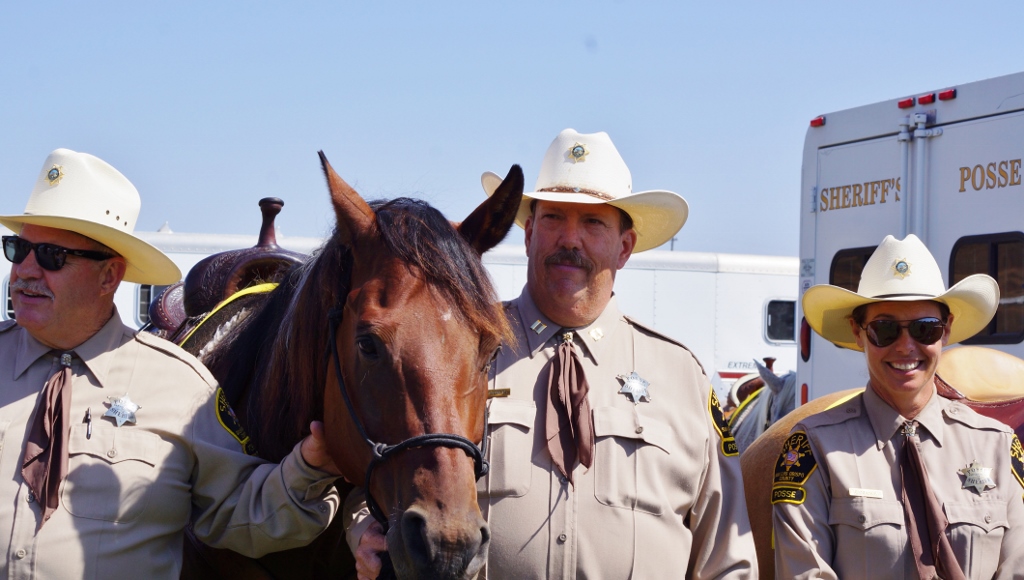 Lyle Thomas (middle) with his horse Mulligan and fellow Posse members.